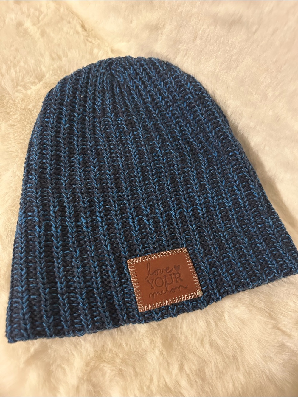 blue and black speckled Love Your Melon knit beanie